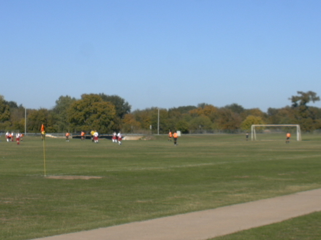 Far away soccer game playing at the Granbury City Park Soccer Fields.